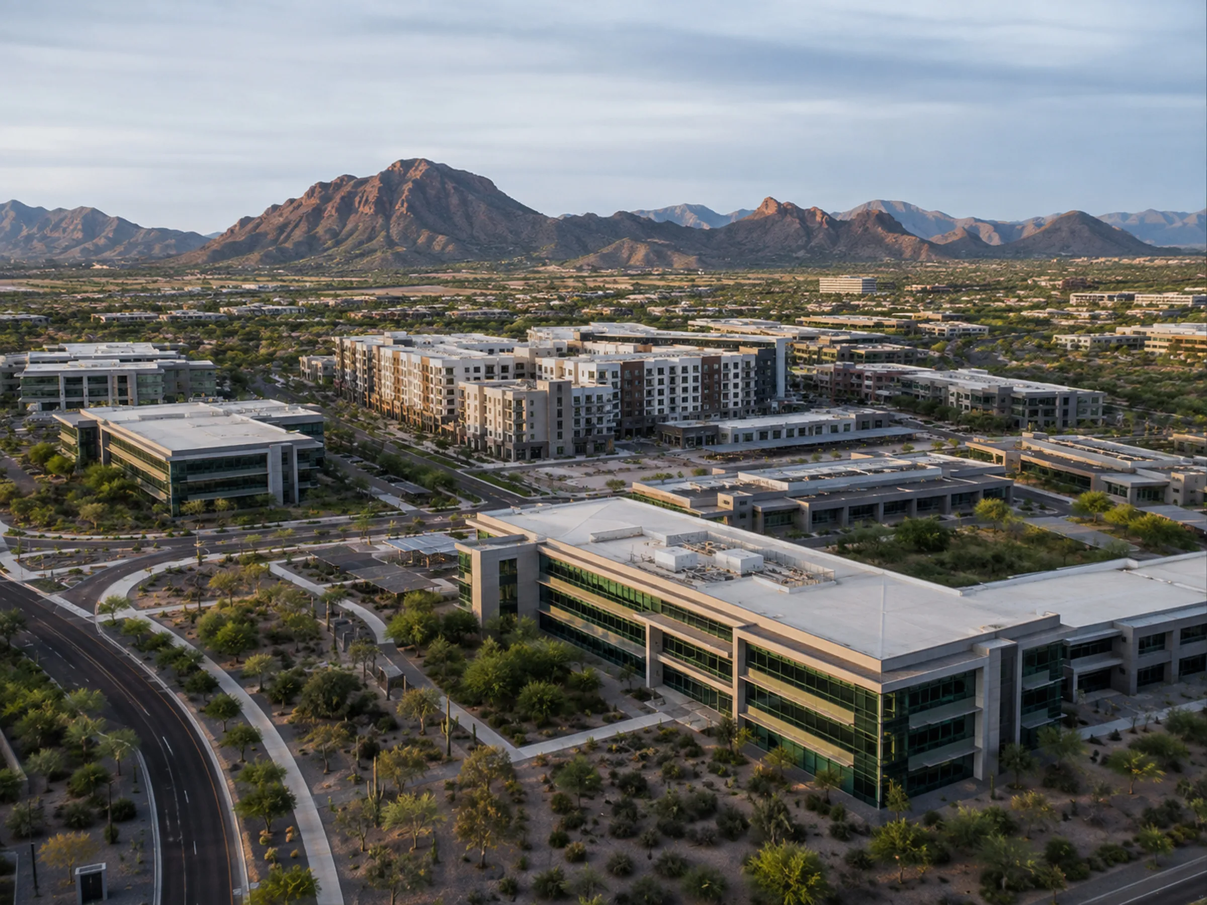 Polished aerial view of a commercial development or facility — presentable, asset-focused, not a lifestyle scene.