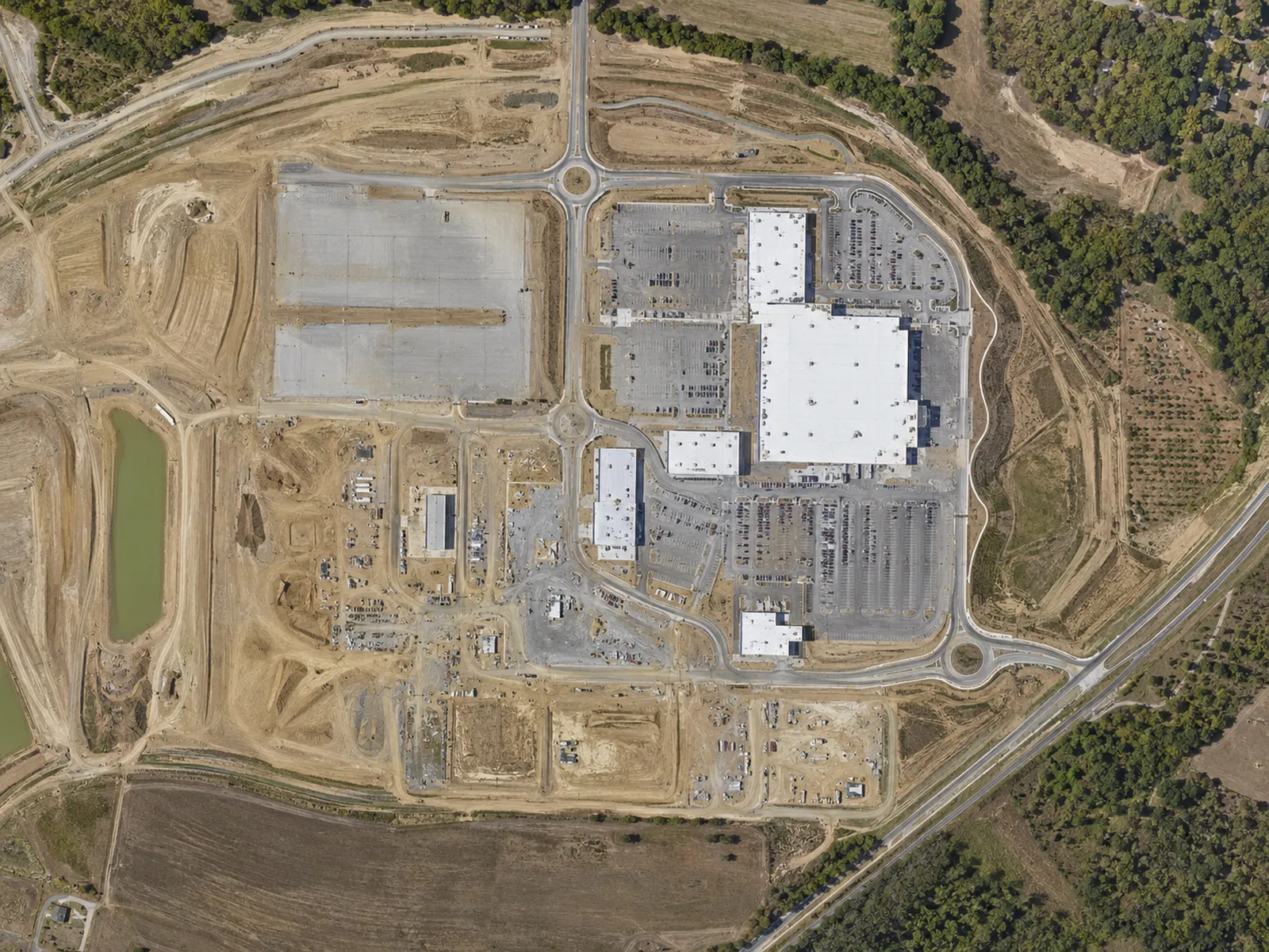 Top-down orthomosaic-style composite of a development site.